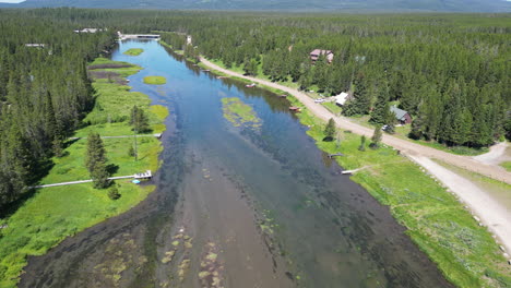 fresh water river with boat docks during a bright summer day