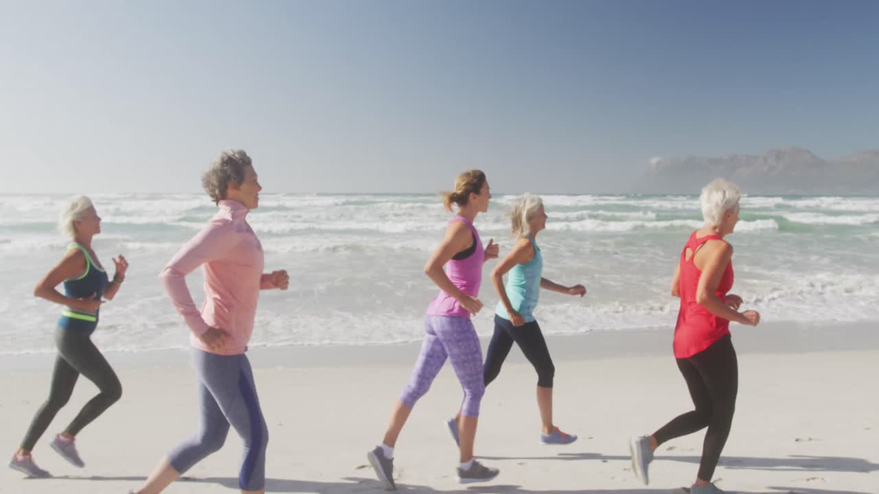 Senior women running on the beach