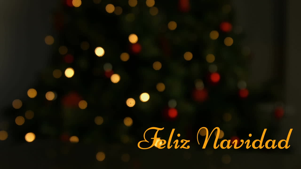 animación de feliz navidad texto sobre el árbol de navidad