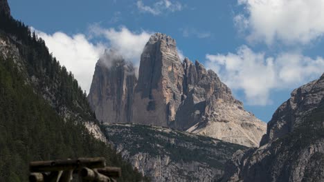 4k-timelapse-of-Tre-Cime-di-Lavaredo,-Dolomites-mountain-range-in-the-Italian-Alps-on-a-sunny-day,-Italy,-Europe