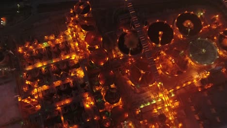 drone top down shot of metal factory at night