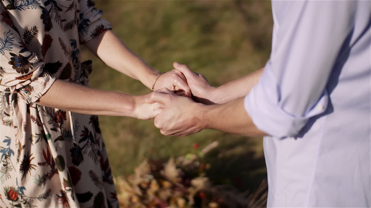 Playful couple embracing in sunlight