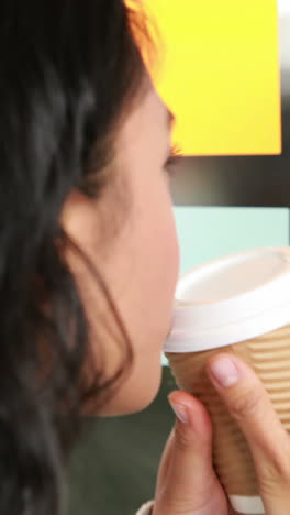 asian businesswoman looking at sticky notes