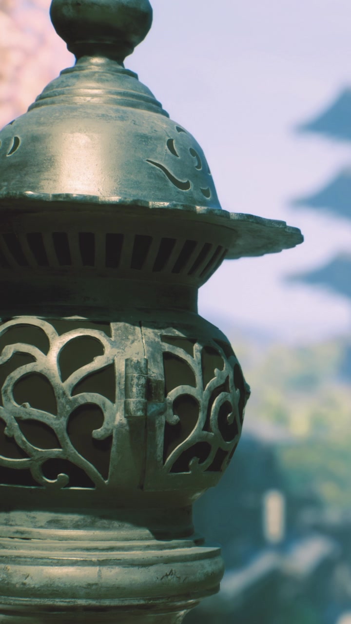 Garden lantern in a traditional setting with distant pagoda structure
