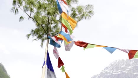 colored flags in the mountains of nepal. manaslu area.