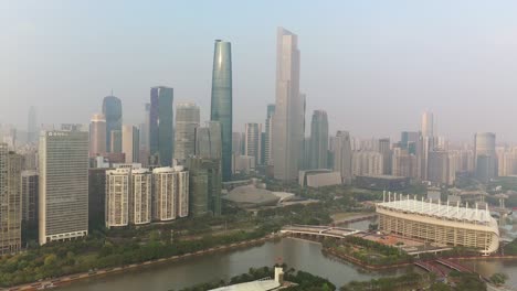 sunny evening guangzhou city downtown famous island stadium riverside aerial panorama 4k china