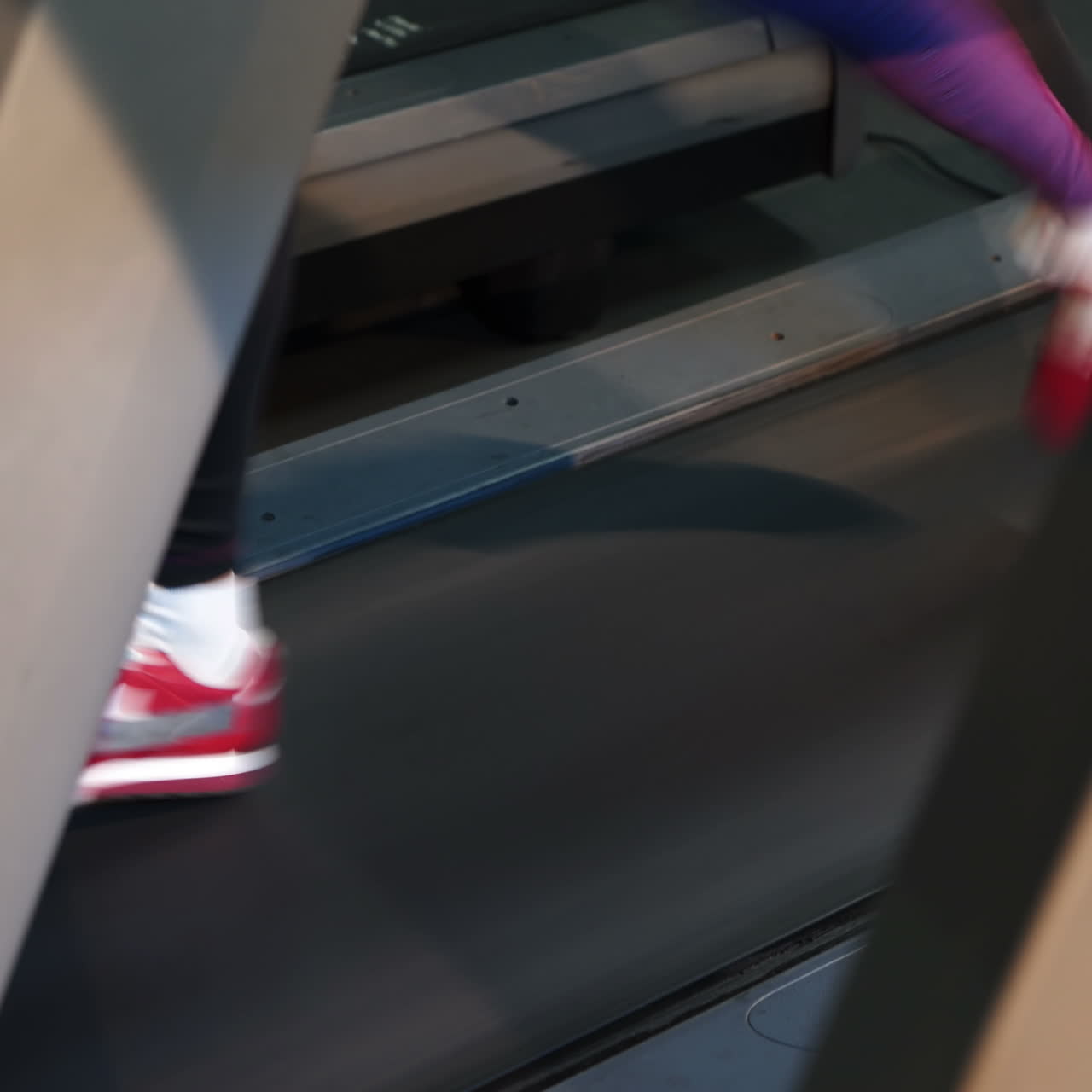 Beautiful athletic woman running on a treadmill at the gym. The ideal female figure. Cardio training Square video