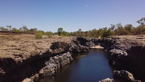 Drone-flying-above-rocky-gorge