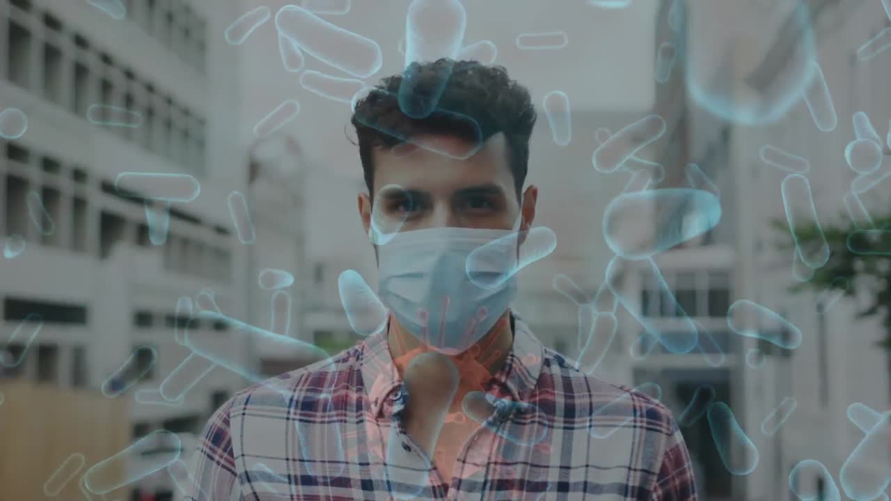 코로나19 세포가 얼굴 마스크를 쓰고 있는 사람을 가로질러 움직이는 애니메이션