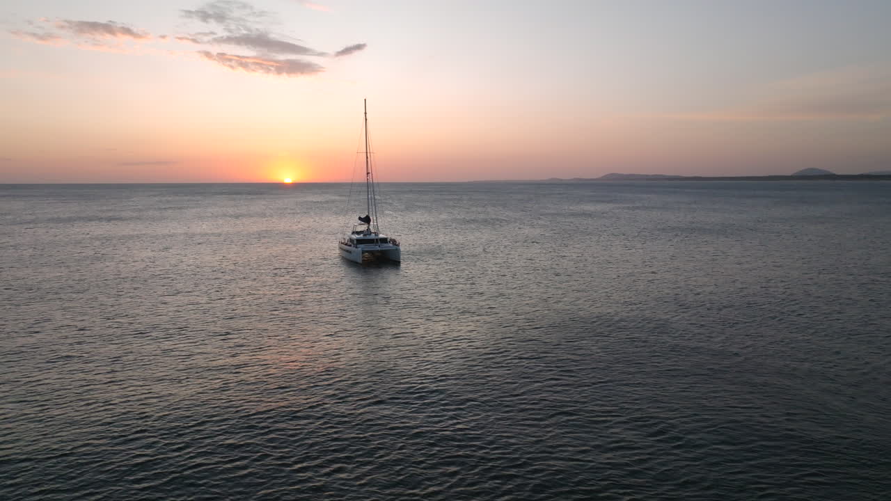 Set sail on an unparalleled sunset adventure as a catamaran glides along Punta del Este's coastline, Uruguay