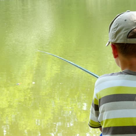 boy fishing nearby river