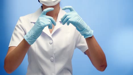 a uniformed nurse makes signs of love and heart with copy space on a blue background