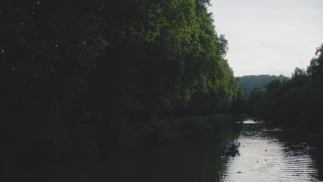 Boat-on-River-in-Tubingen,-Germany-in-4K-Downtown-Home-of-Europes-Oldest-University-At-Sunset