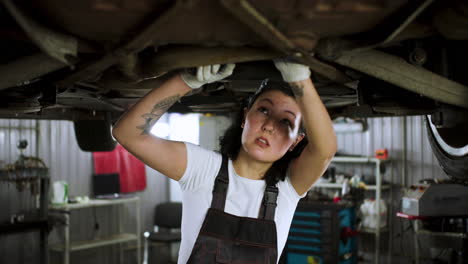 Woman-repairing-car