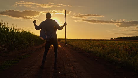 happy farmer celebrating sunset harvest