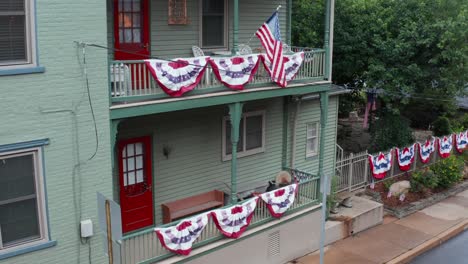 american flags decorate traditional home in usa