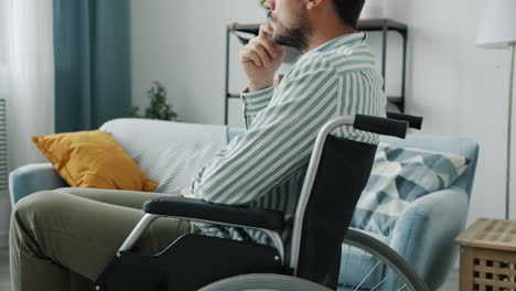 man in wheelchair thinking