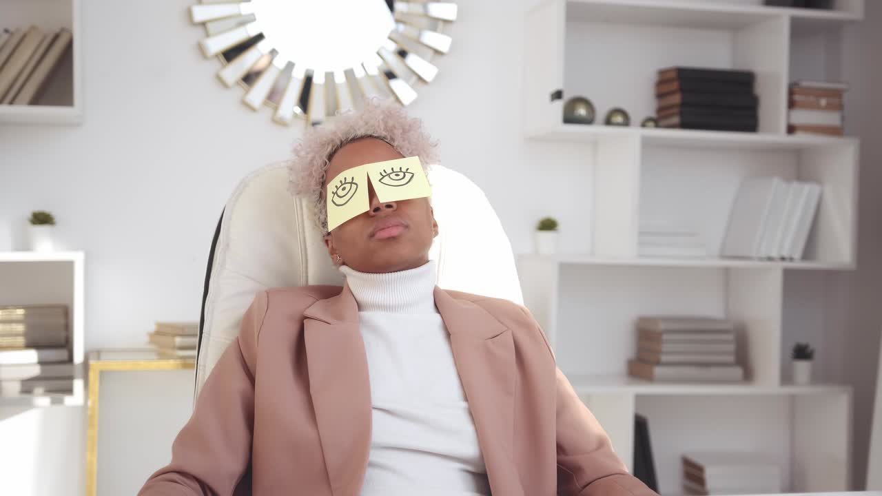 Young african american woman worker sleeps in office due to fatigue and overwork