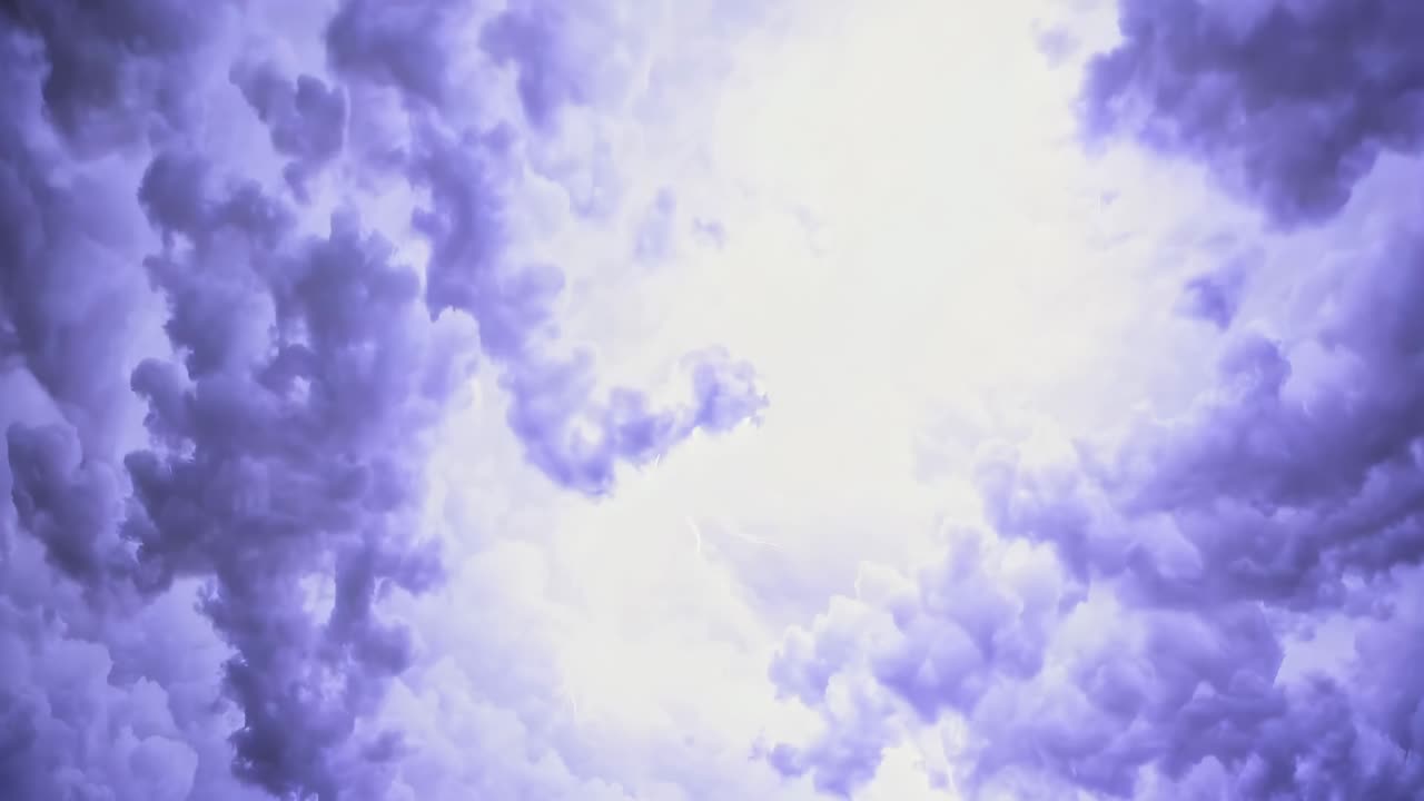 Dramatic video of stormy clouds with lightning, captured from a low-angle perspective