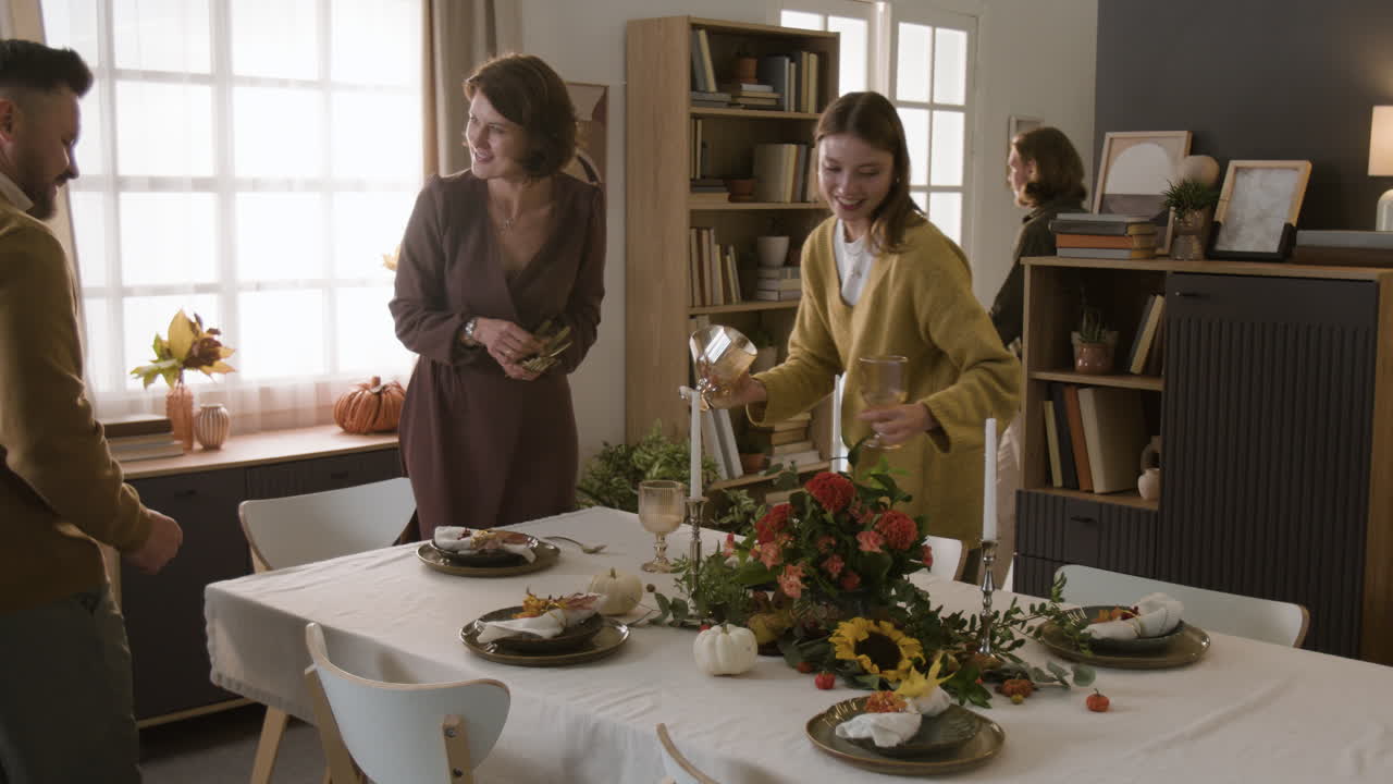 Family Preparing Dining Table for Autumn Meal