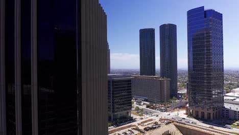 Aerial-close-up-dolly-shot-revealing-Century-City-from-behind-a-skyscraper