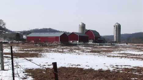 long shot of farm buildings in winter