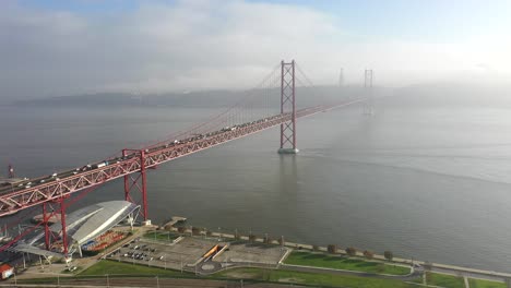 wide aerial shot 25 de abril bridge in lisbon, portugal