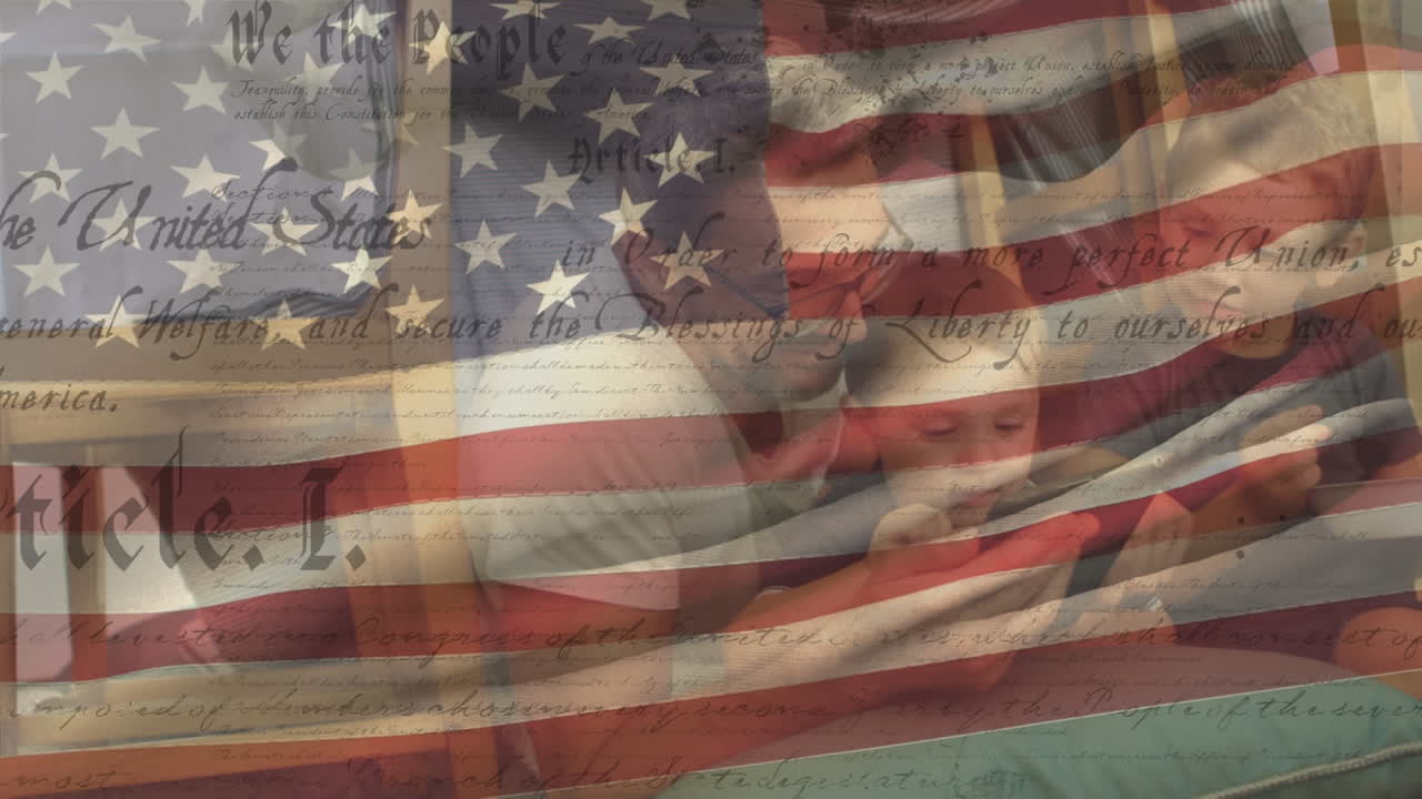Caucasian family using smartphone with US flag waving and constitution foreground