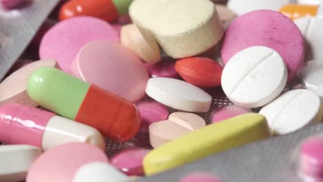 assorted colorful pills and capsules