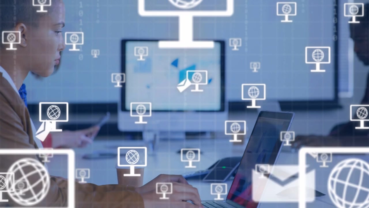 Woman typing laptop at business table activating monitor and envelope icons showing connectivity