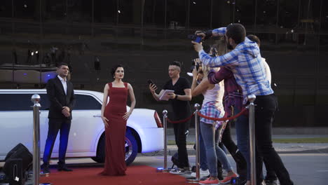 celebrity on red carpet with paparazzi and limousine at an event