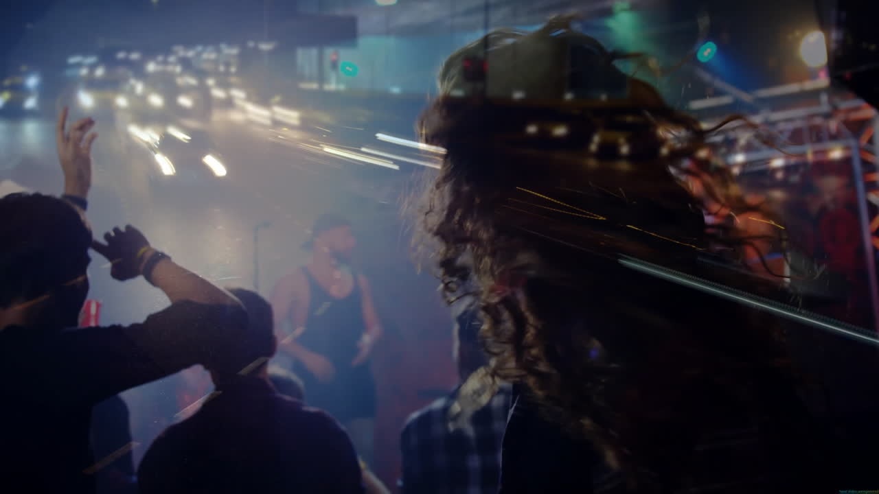 male dancer moving left in live music club marketing clip, with animated light charts and fog