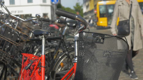 bicycles with baskets parked in the street