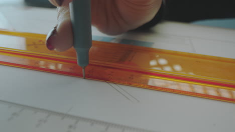 using a ruler to draw a straight line