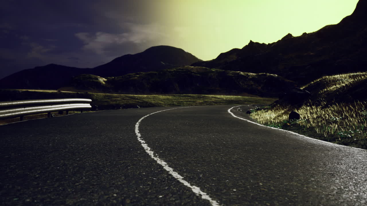 Winding road under a stunning twilight sky in a mountainous landscape