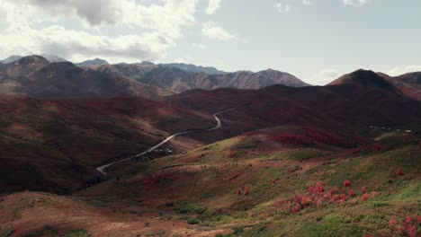 Aerial-drone-shot-of-Salt-Lake-City-mountain-range-with-fall-colored-leaves-at-60fps