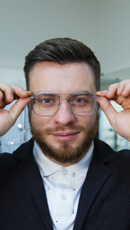 man trying on glasses