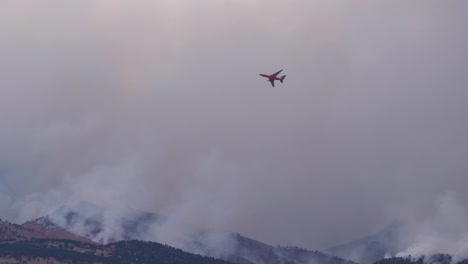 water bomber plane flying over the calwood fire in northern colorado - 10