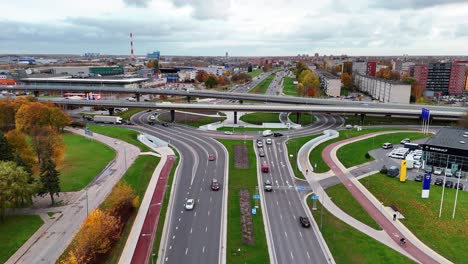 aerial view of a complex highway interchange and cityscape