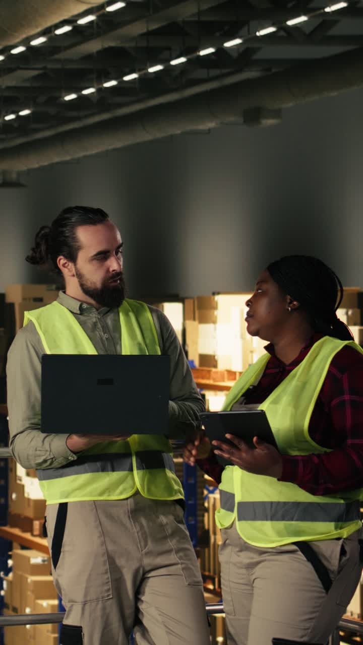 Vertical Video Warehouse staff members managing shipping operations in large fulfillment center