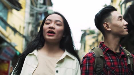 Handheld-view-of-young-Vietnamese-couple-in-the-city