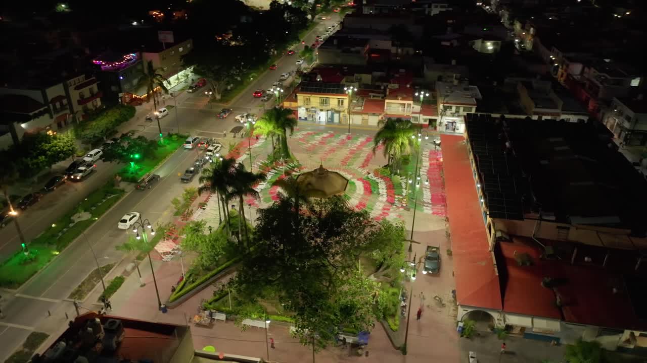 Main square and park in Chapala city, decorated with Mexican paper banners (papel picado) in for Independence Day (Grito de Independencia). Aerial drone orbit
