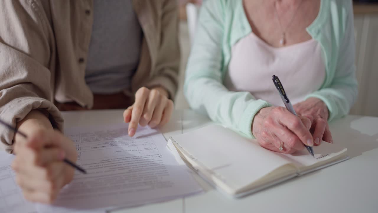 Senior Woman and Young Woman Working Together