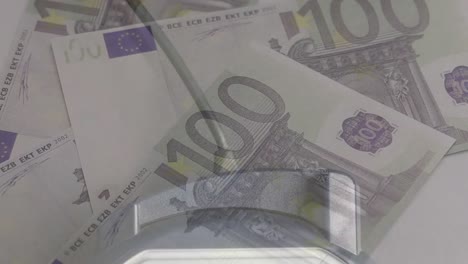 animation of euro banknotes falling over payment terminal