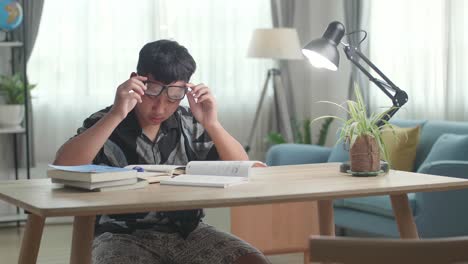 tired teenage boy feel pain eyestrain rubbing dry irritated eyes fatigued from doing home work
