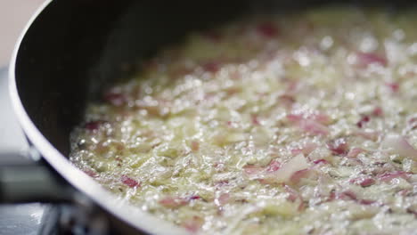 frying chopped garlic and red onion with butter