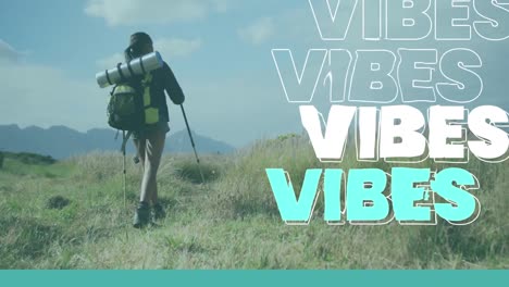 animation of the word vibes in white and blue over woman hiking in countryside