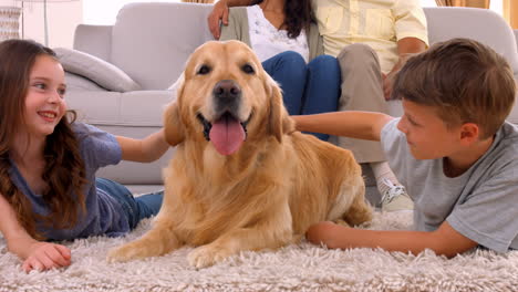 Happy-family-smiling-with-their-dog