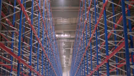 big and modern warehouse under construction, featuring metal shelving and other industrial equipment.