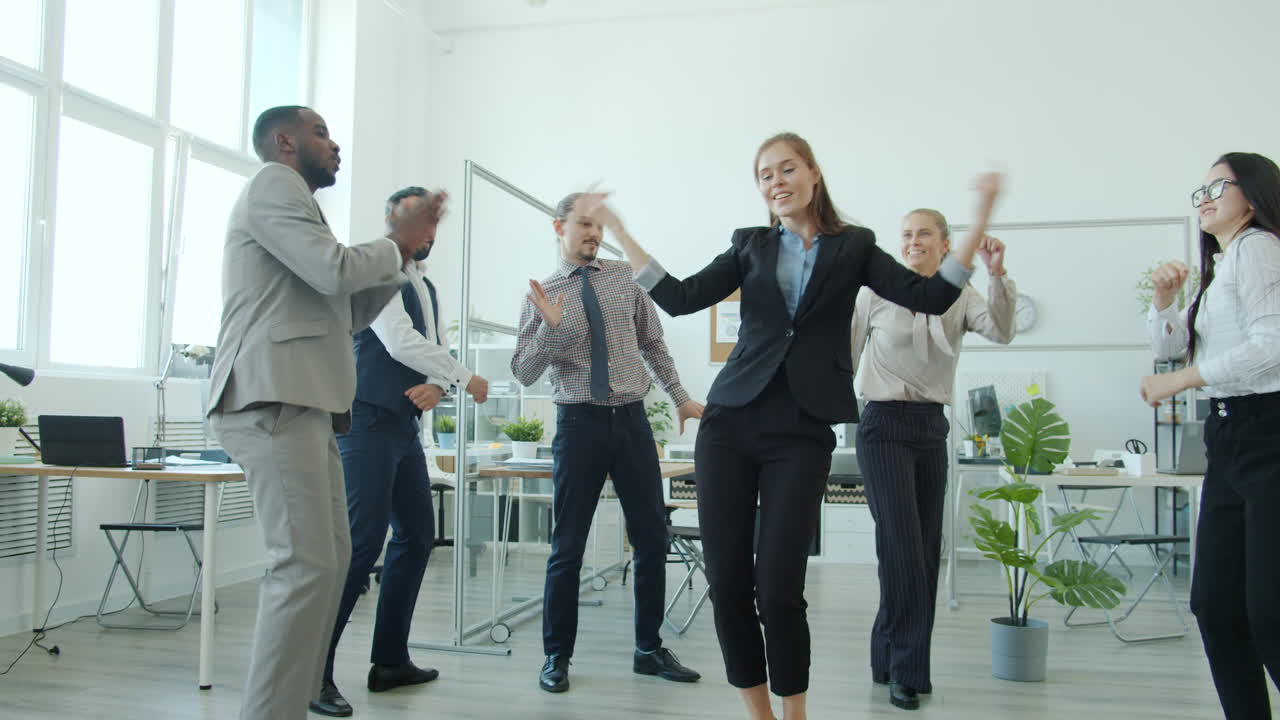 Happy Business Team Dancing in Office